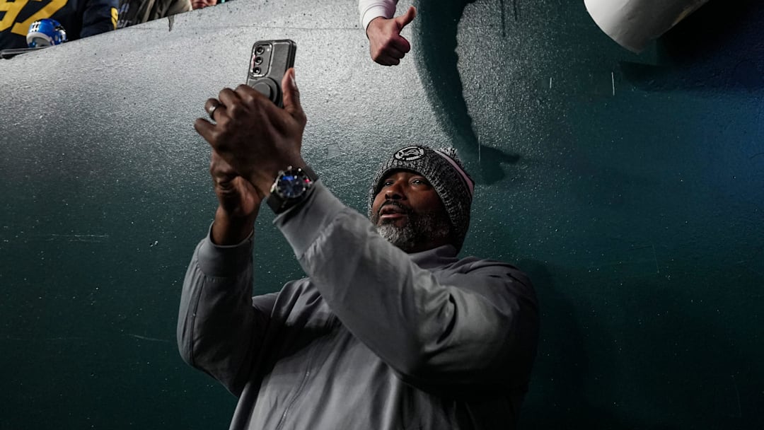 Detroit Lions general manager Brad Holmes takes a selfie with fans ahead of the Philadelphia Eagles game at Lincoln Financial Field in Philadelphia on Sunday, November 16, 2025.