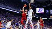Dec 14, 2024; Lexington, Kentucky, USA; Louisville Cardinals guard J'Vonne Hadley (1) goes to the basket against Kentucky Wildcats center Amari Williams (22) during the first half at Rupp Arena at Central Bank Center. Mandatory Credit: Jordan Prather-Imagn Images