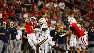 Oct 26, 2024; Tucson, Arizona, USA; Arizona Wildcats quarterback Noah Fifita (11) throws the ball during the fourth quarter against the West Virginia Mountaineers at Arizona Stadium. Mandatory Credit: Aryanna Frank-Imagn Images