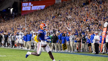 Oct 19, 2024; Gainesville, Florida, USA; Florida Gators running back Jadan Baugh (13) rushes with the ball for a touchdown against the Kentucky Wildcats during the first half at Ben Hill Griffin Stadium. Mandatory Credit: Matt Pendleton-Imagn Images