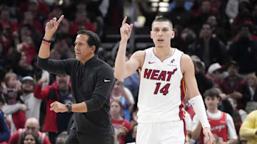 Apr 16, 2025; Chicago, Illinois, USA; Miami Heat guard Tyler Herro (14) and head coach Erik Spoelstra ask for a replay against the Chicago Bulls during the second half at United Center. Mandatory Credit: David Banks-Imagn Images