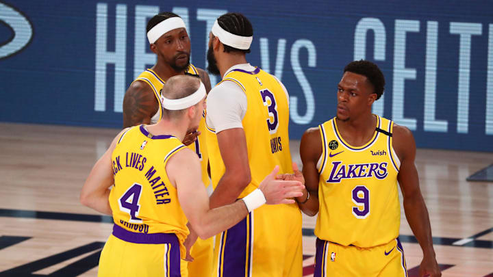 Sep 24, 2020; Lake Buena Vista, Florida, USA; Los Angeles Lakers guard Kentavious Caldwell-Pope (1), Los Angeles Lakers forward Anthony Davis (3), Los Angeles Lakers guard Alex Caruso (4) and Los Angeles Lakers guard Rajon Rondo (9) celebrate after defeating the Denver Nuggets in game four of the Western Conference Finals of the 2020 NBA Playoffs at AdventHealth Arena. Mandatory Credit: Kim Klement-Imagn Images