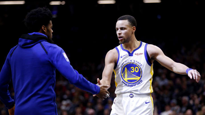 Jan 5, 2019; Sacramento, CA, USA; Golden State Warriors guard Stephen Curry (30) is met by guard Quinn Cook (4) during a timeout against the Sacramento Kings in the fourth quarter at Golden 1 Center. 