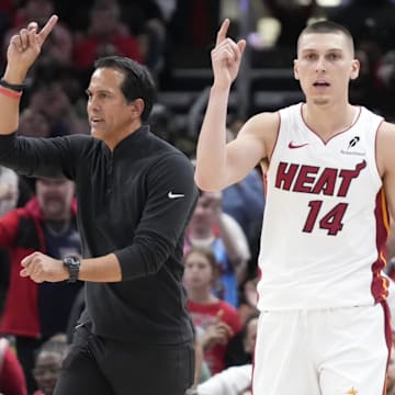 Apr 16, 2025; Chicago, Illinois, USA; Miami Heat guard Tyler Herro (14) and head coach Erik Spoelstra ask for a replay against the Chicago Bulls during the second half at United Center. Mandatory Credit: David Banks-Imagn Images