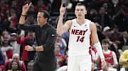 Apr 16, 2025; Chicago, Illinois, USA; Miami Heat guard Tyler Herro (14) and head coach Erik Spoelstra ask for a replay against the Chicago Bulls during the second half at United Center. Mandatory Credit: David Banks-Imagn Images