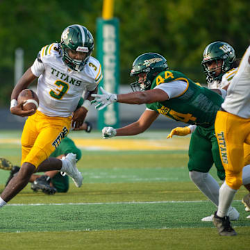Reynold  reaches for West Forsyth’s quarterback, August 23, 2024.