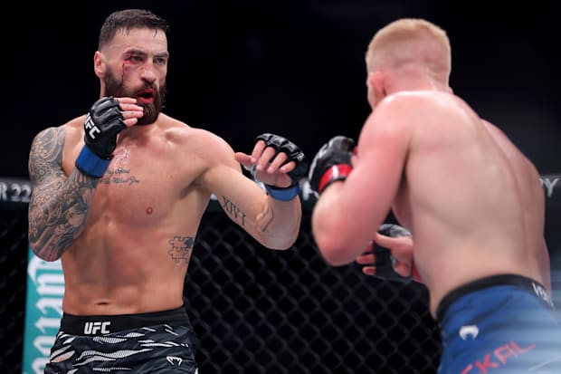 Bo Nickal (red gloves) fights Paul Craig (blue gloves) in the middleweight bout during UFC 309 at Madison Square Garden. 
