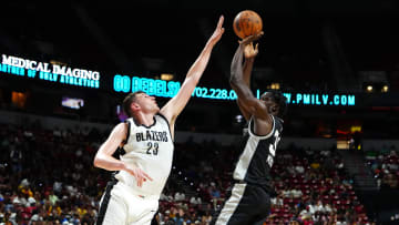 Jul 13, 2024; Las Vegas, NV, USA; San Antonio Spurs forward Nathan Mensah (31) shoots against Portland Trail Blazers center Donovan Clingan (23) during the first quarter at Thomas & Mack Center. Mandatory Credit: Stephen R. Sylvanie-USA TODAY Sports