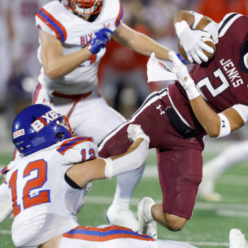 Bixby's Cooper Parker brings down Jenks' Kaydin Jones during the Class 6A-1 high school football championship game between Bixby and Jenks at Chad Richison Stadium in Edmond, Okla., Friday, Dec. 1, 2023.