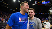 May 15, 2022; Phoenix, Arizona, USA; Dallas Mavericks guard Luka Doncic (right) with former player Dirk Nowitzki against the Phoenix Suns in game seven of the second round for the 2022 NBA playoffs at Footprint Center. Mandatory Credit: Mark J. Rebilas-Imagn Images