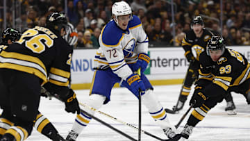 Oct 11, 2025; Boston, Massachusetts, USA; Buffalo Sabres center Tage Thompson (72) tries to go between Boston Bruins center Fraser Minten (93) and defenseman Andrew Peeke (26) during the second period at TD Garden. Mandatory Credit: Winslow Townson-Imagn Images