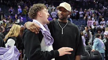 May 16, 2025; San Francisco, California, USA; Golden State Warriors guard Brandin Podziemski (left) and Jonathan Kuminga (right) talk after the game between the Golden State Valkyries and the Los Angeles Sparks at Chase Center. Mandatory Credit: Darren Yamashita-Imagn Images