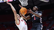 Jan 28, 2025; Salt Lake City, Utah, USA; Cincinnati Bearcats guard Day Day Thomas (1) goes to the basket against Utah Utes forward Keanu Dawes (8) during the first half at Jon M. Huntsman Center. Mandatory Credit: Rob Gray-Imagn Images