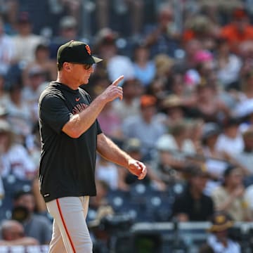 Sep 8, 2024; San Diego, California, USA; San Francisco Giants manager Bob Melvin makes a pitching change in the seventh inning against the San Diego Padres at Petco Park. 