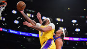 Apr 25, 2024; Los Angeles, California, USA; Los Angeles Lakers forward Anthony Davis (3) shoots ahead of Denver Nuggets forward Aaron Gordon (50) during the second half in game three of the first round for the 2024 NBA playoffs at Crypto.com Arena. Mandatory Credit: Gary A. Vasquez-USA TODAY Sports