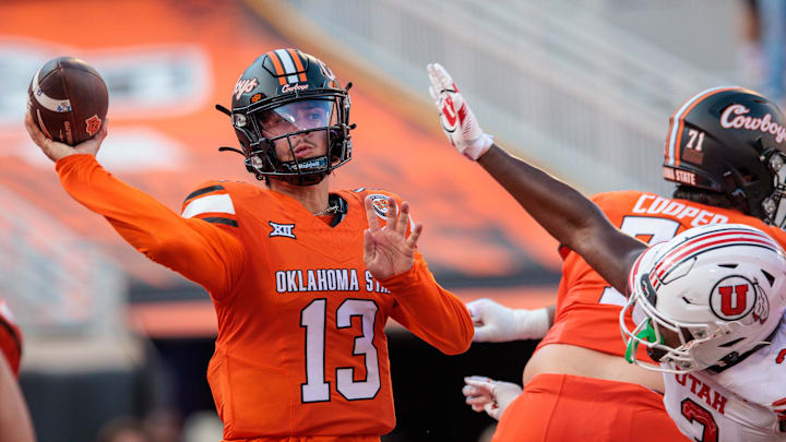 Sep 21, 2024; Stillwater, Oklahoma, USA; Oklahoma State Cowboys quarterback Garret Rangel (13) looks to pass during the fourth quarter against the Utah Utes at Boone Pickens Stadium. Mandatory Credit: William Purnell-Imagn Images