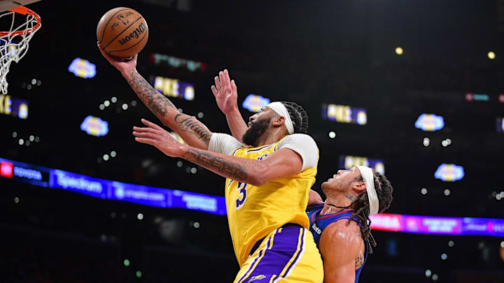 Apr 25, 2024; Los Angeles, California, USA; Los Angeles Lakers forward Anthony Davis (3) shoots ahead of Denver Nuggets forward Aaron Gordon (50) during the second half in game three of the first round for the 2024 NBA playoffs at Crypto.com Arena. Mandatory Credit: Gary A. Vasquez-Imagn Images