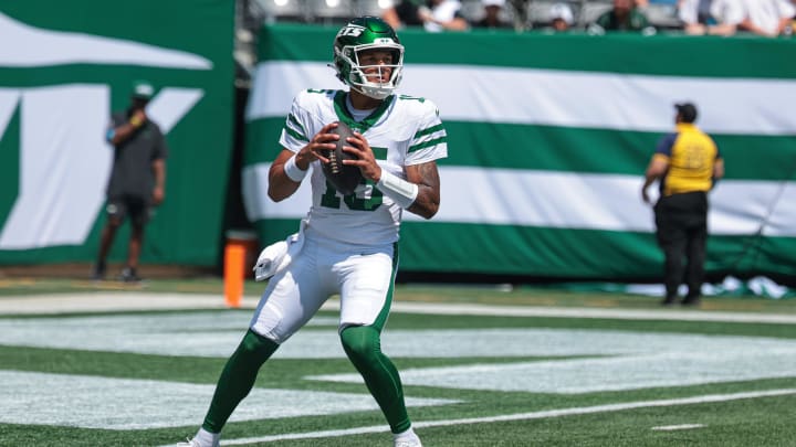 Aug 10, 2024; East Rutherford, New Jersey, USA; New York Jets quarterback Adrian Martinez (15) drops back to pass during the game against the Washington Commanders at MetLife Stadium. Mandatory Credit: Vincent Carchietta-USA TODAY Sports