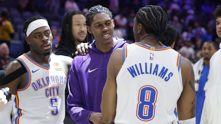Jan 7, 2026; Oklahoma City, Oklahoma, USA; Utah Jazz forward Cody Williams (5) meets his brother Oklahoma City Thunder guard/forward Jalen Williams (8) after their game at Paycom Center. Mandatory Credit: Alonzo Adams-Imagn Images