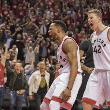 Apr 24, 2017; Toronto, Ontario, CAN; Toronto Raptors guard Norman Powell (24) and center Jakob Poeltl (42) celebrate a basket during the fourth quarter in game five of the first round of the 2017 NBA Playoffs against the Milwaukee Bucks at Air Canada Centre. The Toronto Raptors won 118-93. Mandatory Credit: Nick Turchiaro-Imagn Images