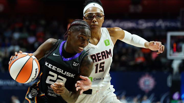 Connecticut Sun guard Saniya Rivers (22) drives the ball against Atlanta Dream guard Allisha Gray (15) in the second half at Mohegan Sun Arena. Connecticut Sun guard Saniya Rivers (22) drives the ball against Atlanta Dream guard Allisha Gray (15) in the second half at Mohegan Sun Arena.