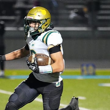 Racine Case's Michael Farr (6) sprints downfield during a WIAA Level 2 playoff game at Mukwonago on Friday, Nov. 1, 2024.