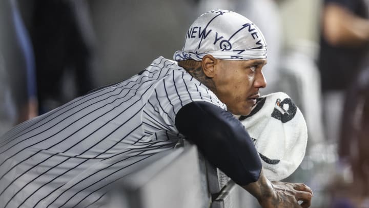 Jun 22, 2024; Bronx, New York, USA;  New York Yankees starting pitcher Marcus Stroman (0) watches from the dugout after being removed from the game in the seventh inning against the Atlanta Braves at Yankee Stadium. Mandatory Credit: Wendell Cruz-USA TODAY Sports