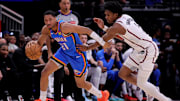 Apr 4, 2025; Houston, Texas, USA; Oklahoma City Thunder guard Aaron Wiggins (21) handles the ball against Houston Rockets guard Amen Thompson (1) during the third quarter at Toyota Center. Mandatory Credit: Erik Williams-Imagn Images