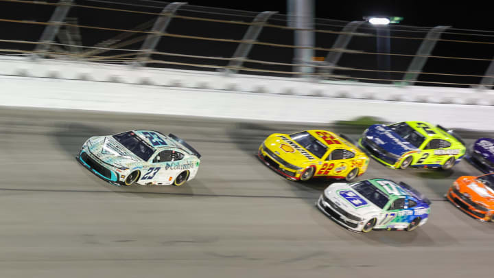 Aug 24, 2024; Daytona Beach, Florida, USA; NASCAR Cup Series driver Bubba Wallace (23) leads the field during the Coke 400 at Daytona International Speedway. 