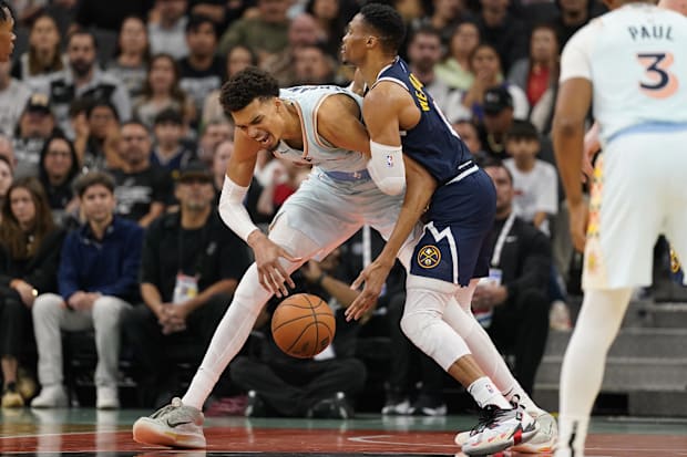 Denver Nuggets guard Russell Westbrook (4) commits a foul against San Antonio Spurs center Victor Wembanyama (1) during the s