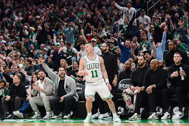 Fans cheer after a three point basket by Boston Celtics guard Payton Pritchard (11)