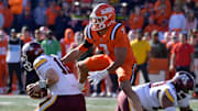 Nov 2, 2024; Champaign, Illinois, USA;  Illinois Fighting Illini defensive back Matthew Bailey (7) tackles Minnesota Golden Gophers quarterback Max Brosmer (16) during the second half at Memorial Stadium. Mandatory Credit: Ron Johnson-Imagn Images