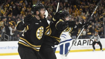 May 4, 2024; Boston, Massachusetts, USA; Boston Bruins right wing Justin Brazeau (55) and center Trent Frederic (11) react on a goal by defenseman Hampus Lindholm (27) (not pictured) during the third period in game seven of the first round of the 2024 Stanley Cup Playoffs against the Toronto Maple Leafs at TD Garden. Mandatory Credit: Bob DeChiara-USA TODAY Sports