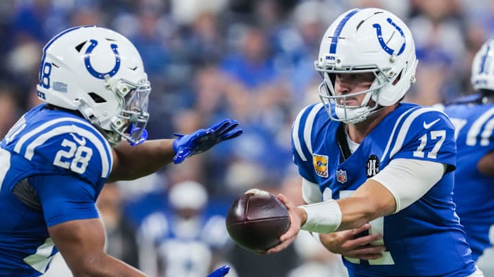 Indianapolis Colts quarterback Daniel Jones (17) hands off the ball to Indianapolis Colts running back Jonathan Taylor (28) on Sunday, Oct. 5, 2025, during a game against the Las Vegas Raiders at Lucas Oil Stadium in Indianapolis.