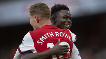 Bukayo Saka and Emile Smith Rowe embrace in 2021