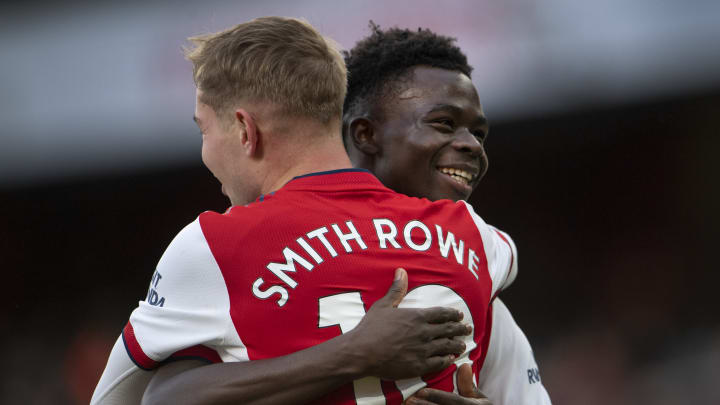 Bukayo Saka and Emile Smith Rowe embrace in 2021