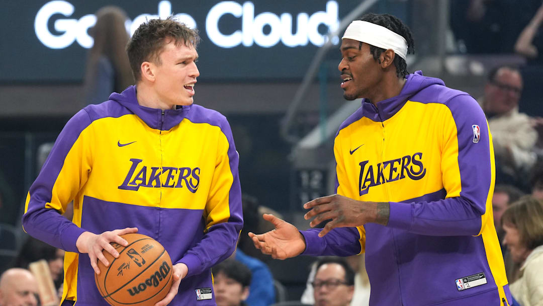 Jan 25, 2025; San Francisco, California, USA; Los Angeles Lakers guard Dalton Knecht (left) and forward Jarred Vanderbilt (right) talk before the game against the Golden State Warriors at Chase Center. Mandatory Credit: Darren Yamashita-Imagn Images