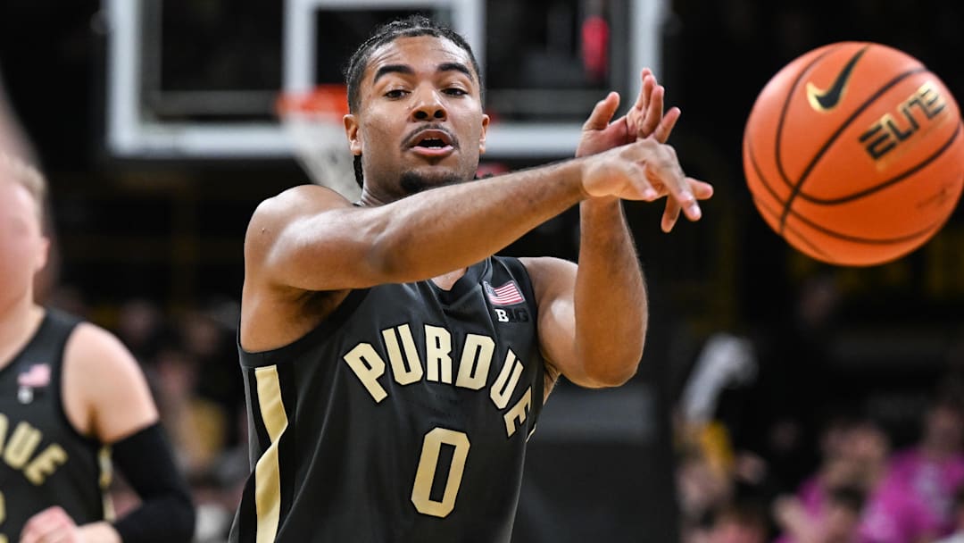 Purdue Boilermakers guard C.J. Cox (0) passes the ball against the Iowa Hawkeyes.