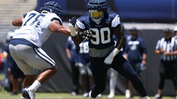 Jul 30, 2024; Oxnard, CA, USA; Dallas Cowboys defensive end DeMarcus Lawrence (90) rushes against offensive tackle Terence Steele (78) during training camp at the River Ridge Playing Fields in Oxnard, California. 