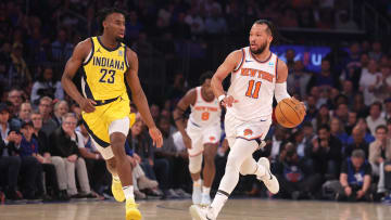 New York Knicks guard Jalen Brunson (11) brings the ball up.