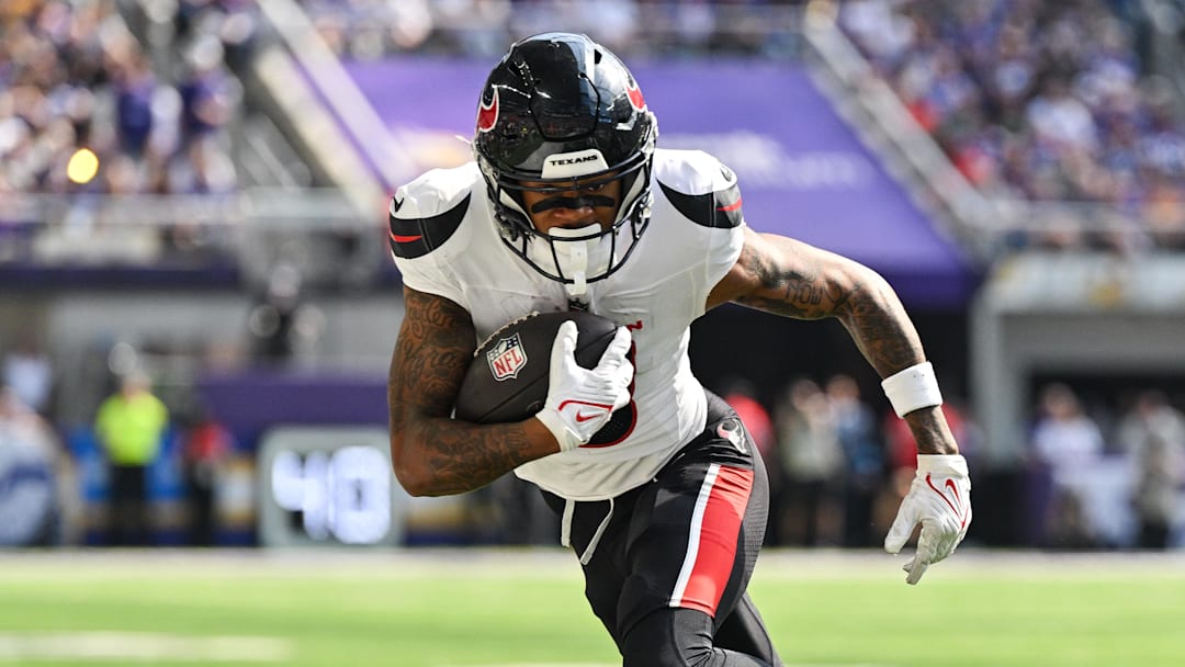 Sep 22, 2024; Minneapolis, Minnesota, USA; Houston Texans wide receiver Tank Dell (3) runs the ball against the Minnesota Vikings during the third quarter at U.S. Bank Stadium.