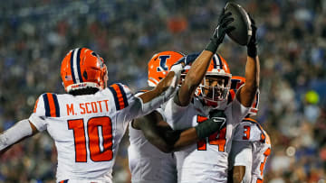 Sep 8, 2023; Lawrence, Kansas, USA; Illinois Fighting Illini defensive back Xavier Scott (14) celebrates with teammates after an interception during the second half against the Kansas Jayhawks at David Booth Kansas Memorial Stadium. Mandatory Credit: Jay Biggerstaff-USA TODAY Sports