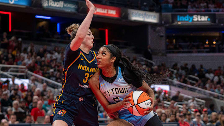 Chicago Sky forward Angel Reese (5) looks to shoot the ball while being guarded by Indiana Fever forward Katie Lou Samuelson (33) on Sunday June 16, 2024, during the game at Gainbridge Fieldhouse in Indianapolis. The Fever beat the Sky 91-83.