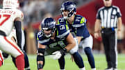 Sep 25, 2025; Glendale, Arizona, USA; Seattle Seahawks center Jalen Sundell (61) prepares to snap the ball to quarterback Sam Darnold (14) against the Arizona Cardinals at State Farm Stadium. Mandatory Credit: Mark J. Rebilas-Imagn Images