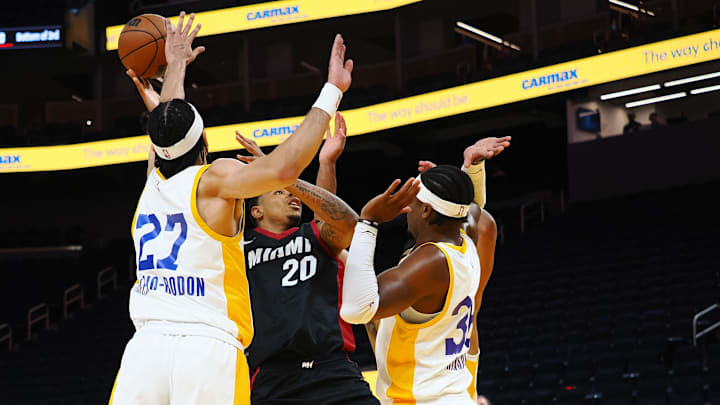 Jul 10, 2024; San Francisco, CA, USA; Miami Heat forward Keshad Johnson (20) shoots the ball between Los Angeles Lakers forward/guard Vincent Valerio-Bodon (27) and forward Blake Hinson (36) during the second quarter at Chase Center. Mandatory Credit: Kelley L Cox-Imagn Images