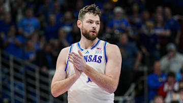 Dec 31, 2024; Lawrence, Kansas, USA; Kansas Jayhawks center Hunter Dickinson (1) reacts during the first half against the West Virginia Mountaineers at Allen Fieldhouse. Mandatory Credit: Jay Biggerstaff-Imagn Images