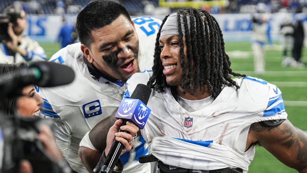 Detroit Lions offensive tackle Penei Sewell (58) interrupts as running back Jahmyr Gibbs (0) is being interviewed 