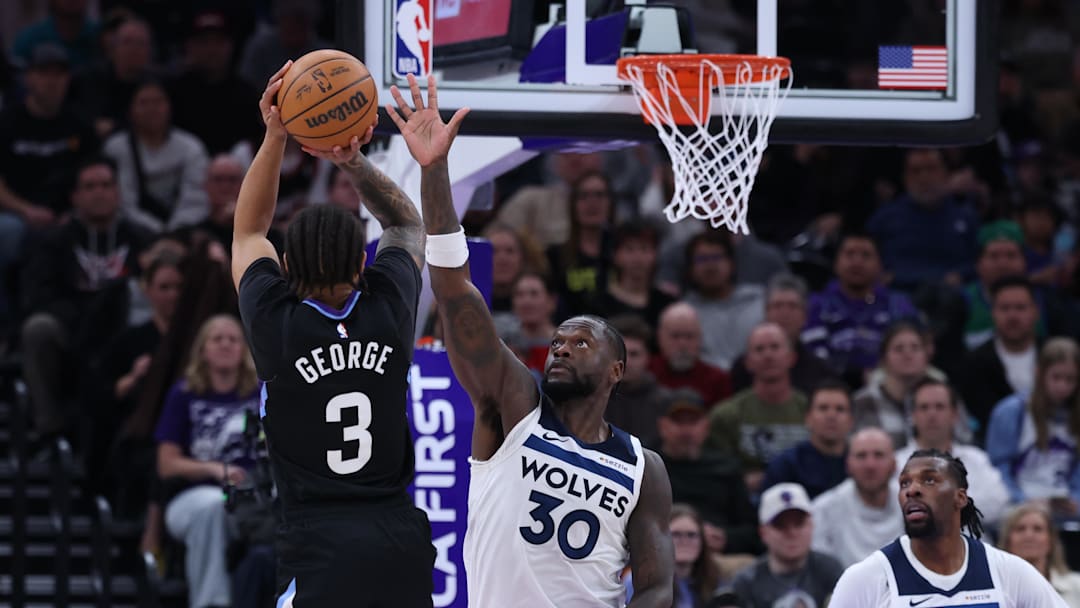 Jan 20, 2026; Salt Lake City, Utah, USA; Utah Jazz guard Keyonte George (3) shoots over Minnesota Timberwolves forward Julius Randle (30) during the second half at Delta Center. Mandatory Credit: Rob Gray-Imagn Images