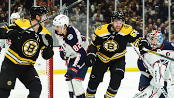 Dec 28, 2024; Boston, Massachusetts, USA; Boston Bruins right wing Justin Brazeau (55) reacts with center Trent Frederic (11) after scoring a goal past Columbus Blue Jackets goaltender Daniil Tarasov (40) during the first period at TD Garden. Mandatory Credit: Bob DeChiara-Imagn Images