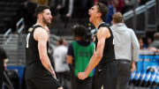 Colorado Buffaloes forward Tristan da Silva (23) and guard Luke O'Brien (0) celebrate after defeating the Florida Gators in the first round of the 2024 NCAA Tournament at Gainbridge FieldHouse. 